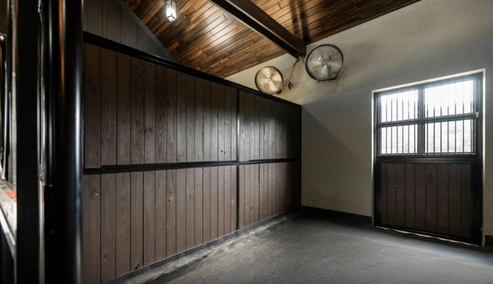 Horse Stall with Full lumber filled partition. And Flooring installed with StableComfort Horse Stall Mattress.